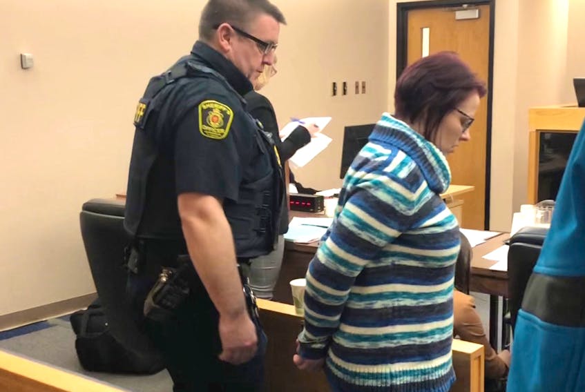 A sheriff escorts Cynthia Shute from a St. John’s courtroom during a break in her sentencing hearing Monday afternoon. Tara Bradbury/The Telegram