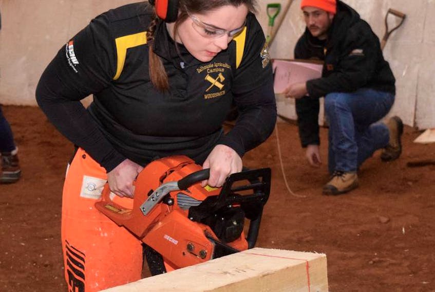 Megan Wynn displayed her talents with a chainsaw as she sped through her heat of the stock saw event at the 33rd Annual Rick Russell Woodsmen Competition in 2018. This year’s event will be held on Feb. 9.