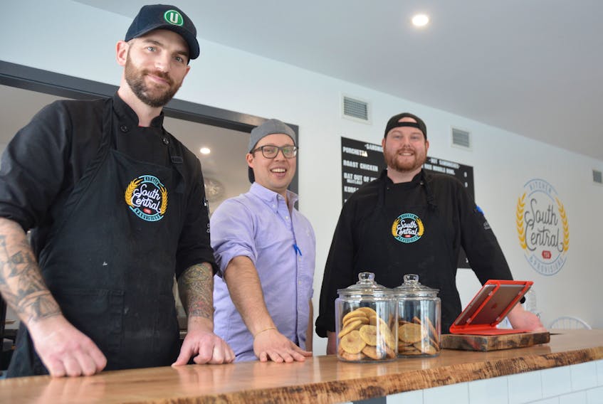 After many months of renovations, South Central Kitchen and Provisions is open for business at 24 Central Street in Summerside. Running the show behind the restaurant's counter and in the kitchen are, from left, Aaron Jackson, Dan Kutcher and Ian Gass.