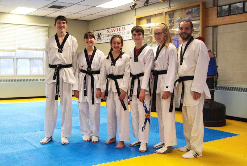 Xavier Taekwondo Club athletes Ewan MacDuff (left), Keira MacDuff, Leah Grant, Cole Allen, and Rebekeah Pitts, as well as coach/instructor Jeremy Reeve, are off to Warren, Michigan for the Michigan-Midwest Taekwondo Championships which takes place Dec. 1.