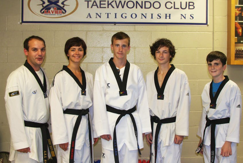 Xavier Taekwondo head coach Jeremy Reeve (left) joins members Maggie MacDonald, Lucas MacLean, Tim Matthes and Cole Allen for a photo, just prior to their training session Sept. 18. The four local athletes, along with Emma MacDonald, will be competing in the Canada Open in Montreal, from Sept. 29 to Oct. 2, and all but Cole – because his age category isn’t included – will also compete in the Commonwealth Championships, just prior to the Open, at the same facility in Montreal.