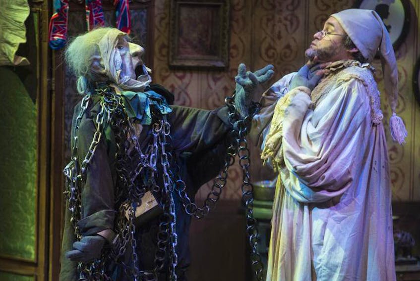 Puppeteer Simon Henderson, performing as the ghost of Jacob Marley, and Rhys Bevan-John, playing Ebenezer Scrooge, run through a scene during the media call for Dickens’ A Christmas Carol on Nov. 28. The longstanding holiday classic will run until Dec. 27 on Neptune’s Scotiabank Stage.