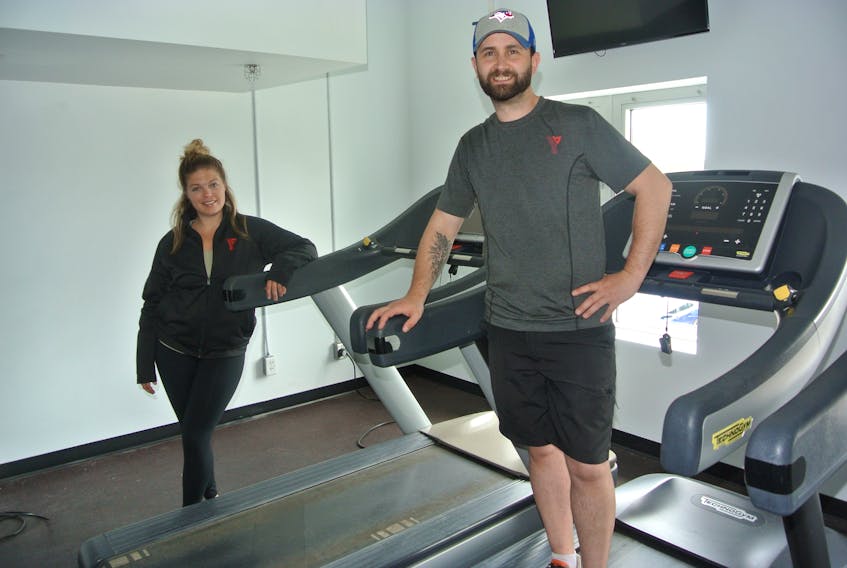 Cumberland YMCA fitness co-ordinator Laura Farrow and fitness supervisor Jimmy Ward stand by a group of treadmills in the wellness centre at the Amherst facility. After being closed since mid-March, the YMCA is opening on Monday.