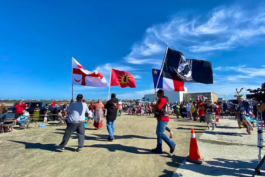 Flags are carried during the Grand Entry of Treaty Day celebrations at the Saulnierville, N.S., wharf on Oct. 1.