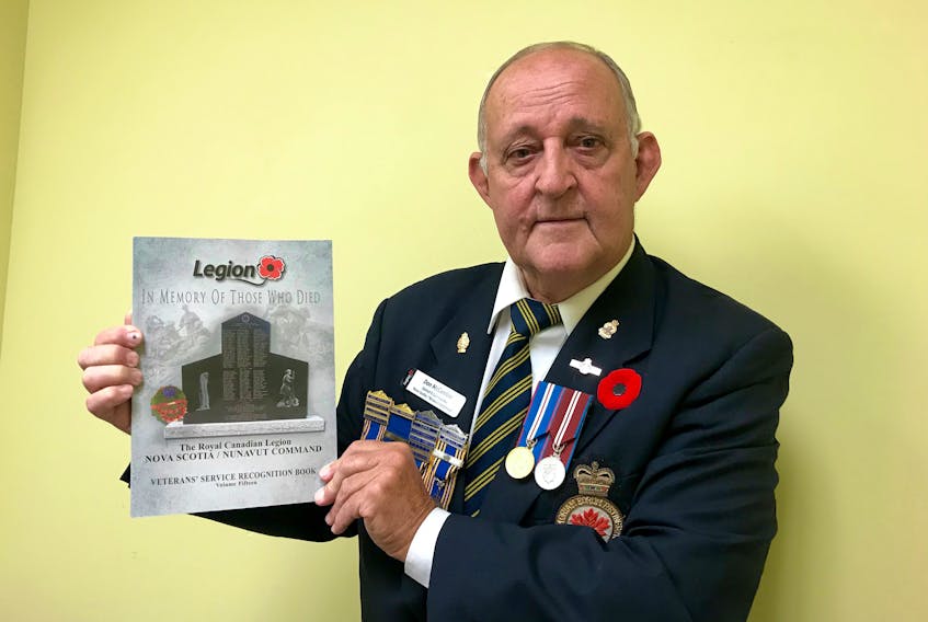 Don McCumber, poppy/remembrance chairman for the Royal Canadian Legion Nova Scotia/Nunavut Command, with the most recent edition of the Veterans’ Service Recognition Book.