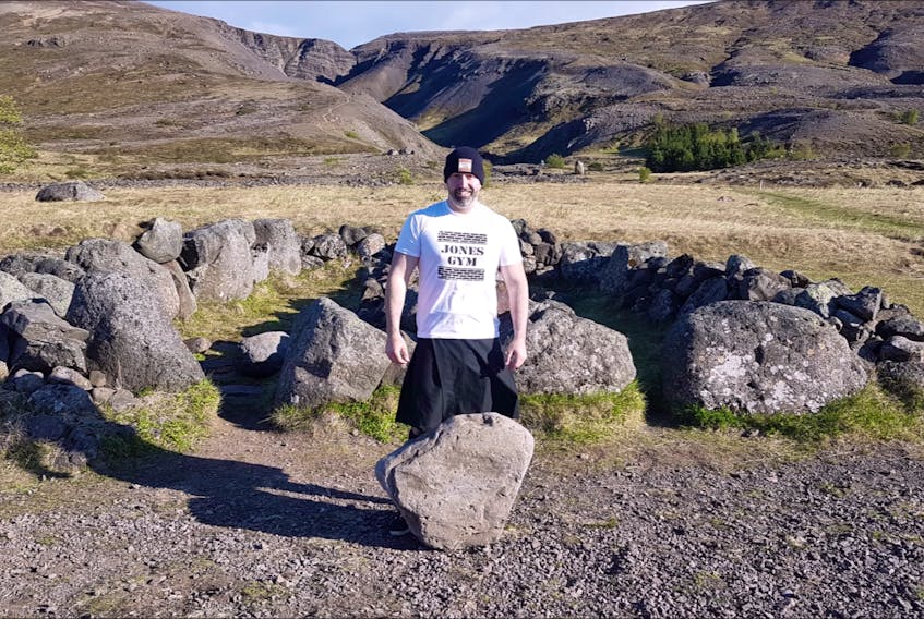 Keith Surette with the Húsafell stone in Iceland.