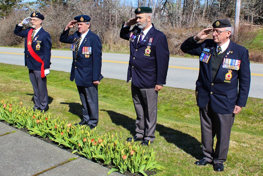 After a wreath laying on May 8 at the Wedgeport Legion's war memorial, giving the salute are, from left to right, Roland LeBlanc, Clinton Saulnier, Curtis Doucet and André Boudreau. (Photo contributed/Cyrille LeBlanc)