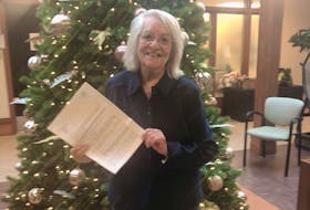 Joan LeBlanc holds a letter she received from her friend after tracking her down in Ireland after some chance clues in a newspaper article. CONTRIBUTED