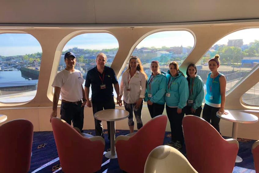 The Cat captain Matthew Burns and Chris Boyd, ServiceMaster of the Valley president, with Jana Jeffery and some of her staff: Christine Middleton, Sam Comeau, Stacey Siscoe and Danielle Bateman.  CONTRIBUTED