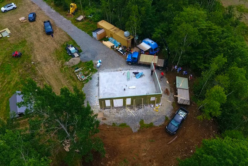 The walls starting to go up on the Gilbert's Cove home. The process of putting up the exterior walls and roof took roughly 12 hours. PHOTO COURTESY JD COMPOSITES