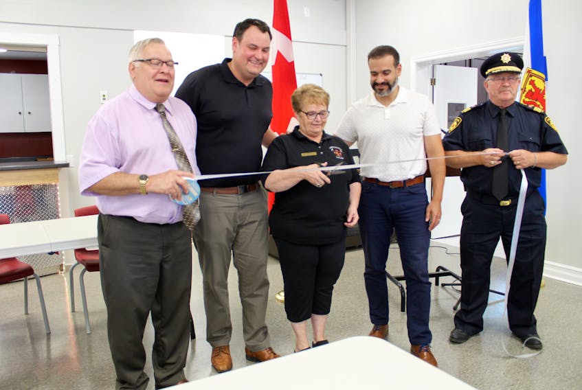 Cutting the ribbon at the Sept. 6 grand opening for the Lakes and District fire hall in Yarmouth County. From left: Yarmouth Warden Leland Anthony, West Nova MP Colin Fraser, Corinne Killam, president of the Lakes and District’s auxiliary, Yarmouth MLA and provincial cabinet minister Zach Churchill, Lakes and District fire chief Scott Killam.