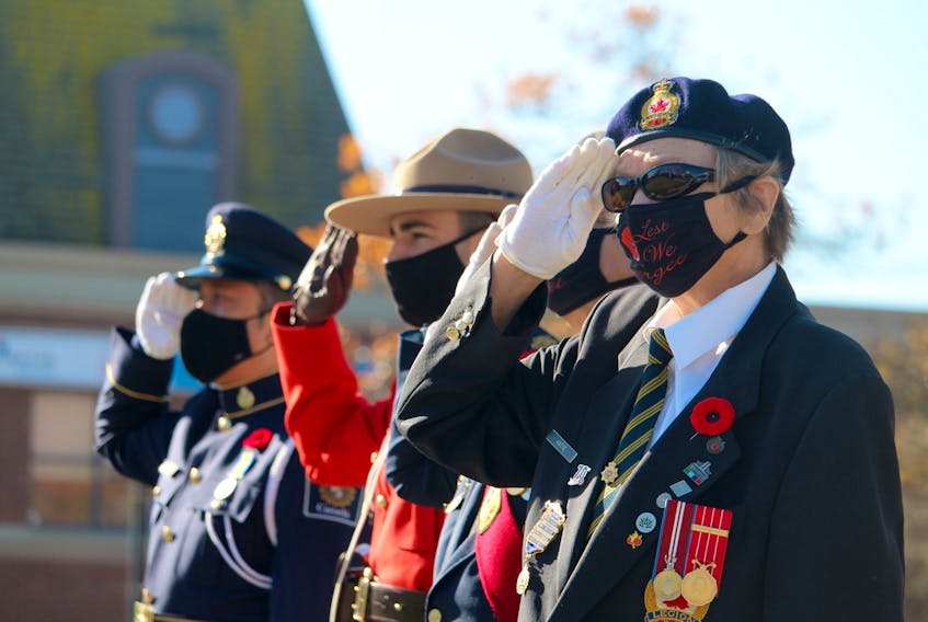 Standing at attention during the Remembrance Day service at the Yarmouth cenotaph.