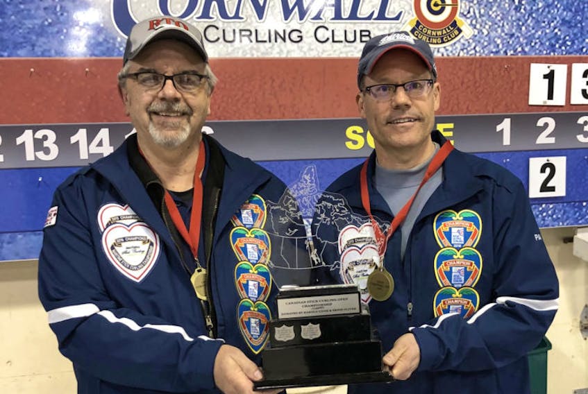 Dave McDougal and Paul Doucet, pictured after winning last year’s national stick curling title in Cornwall, P.E.I., are the reigning Nova Scotia champs and will take part in the provincials to be held in Yarmouth Feb. 14-16.