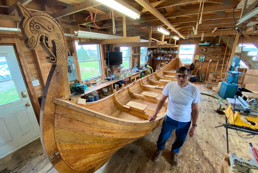 David Surette alongside the Viking ship he’s built for his three-year-old grandson in Norway.