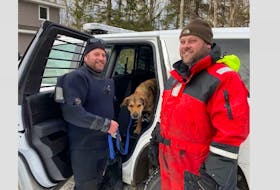 Nathaniel Denton and Mike Titus following their rescue of a dog that was stranded on the ice in Haines Lake, Digby County on Sunday, March 14. The neighbours rescued the dog via a canoe after breaking up ice to make a path to the animal. ZANE LYNCH PHOTO