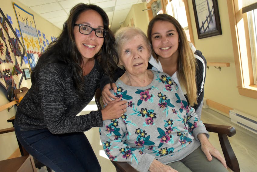 Carmen Surette and her daughter Heidi, who both work as continuing care assistants at Nakile Home for Special Care in Yarmouth County spend some time with resident Annie Ostergaard. TINA COMEAU PHOTO