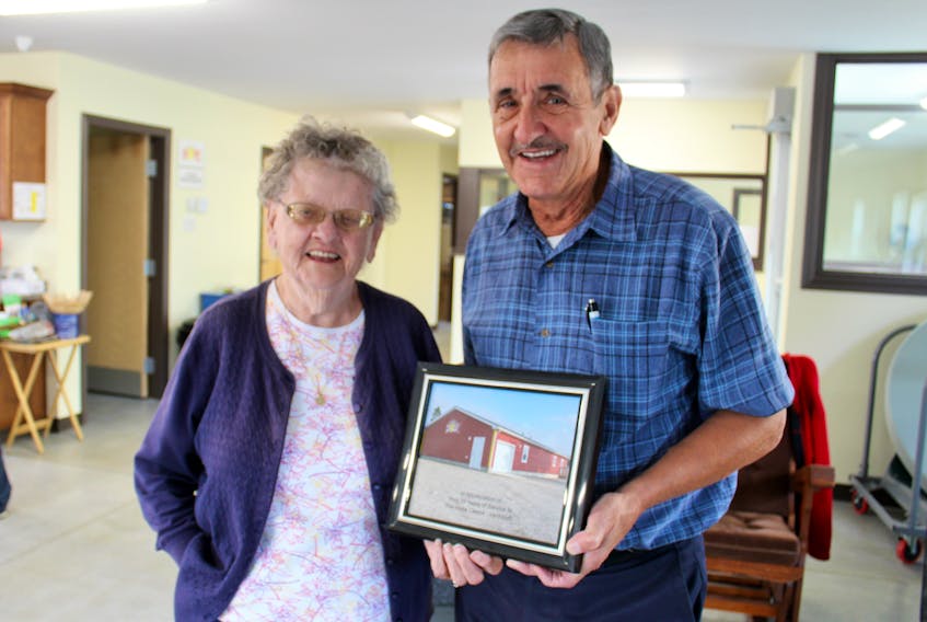 Loretta Pilkington and Doug Thistle at the HOPE Centre in Yarmouth. Prior to a HOPE board meeting on Sept. 10, Thistle, chairman of HOPE’s board of directors, presented Pilkington – who has been involved in HOPE for 35 years – with a framed picture of the HOPE Centre taken by Percy Cottreau. Pilkington is getting ready to move to New Brunswick.