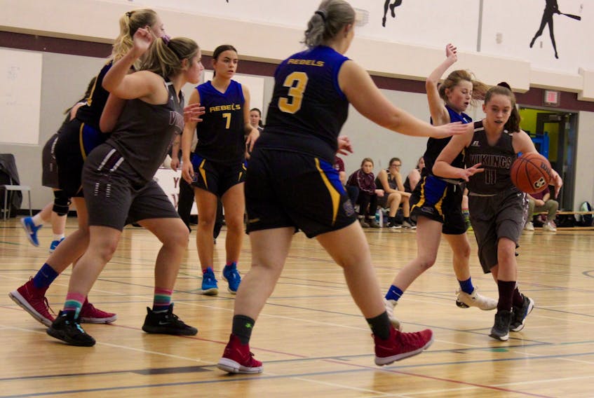 High school girls basketball action from last December’s Steve Brewer memorial tournament in Yarmouth. The host YCMHS Vikings and Shelburne Rebels are pictured here in the opening game of that tournament. More recently, the same two teams played each other at a tournament in Middleton, where the Vikings won again and captured their third tournament title of the 2019-2020 season. ERIC BOURQUE