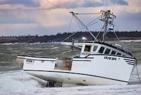 The fishing vessel "Guess' went aground west of Yarmouth Bar on Dec. 15. The five crew members made it safely to shore.  Ervin Olsen Photo
