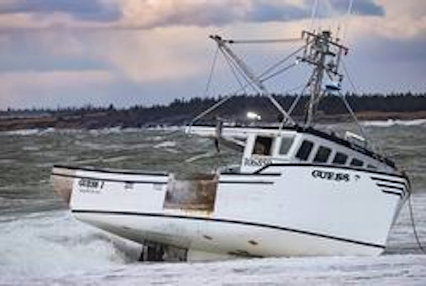 The fishing vessel "Guess' went aground west of Yarmouth Bar on Dec. 15. The five crew members made it safely to shore.  Ervin Olsen Photo