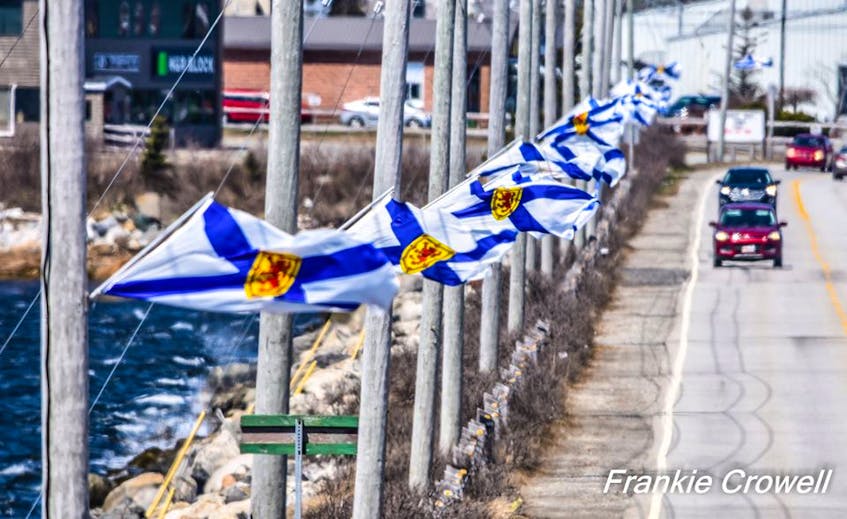 Nova Scotia flags mounted along the Cape Sable Island causeway in the Municipality of Barrington in honour of the lives lost during the April 18-19 mass shooting in the province. FRANKIE CROWELL PHOTO