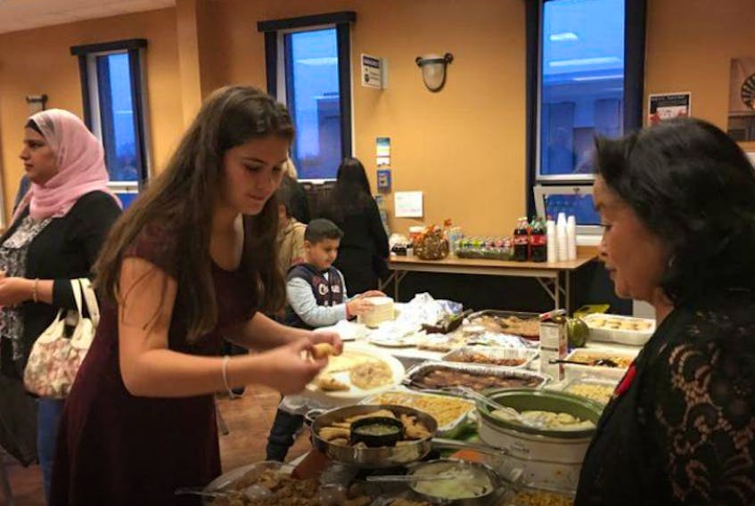 Newcomer potlucks have become a tradition in the Yarmouth area, organized by YREACH representative Dolores Atwood.