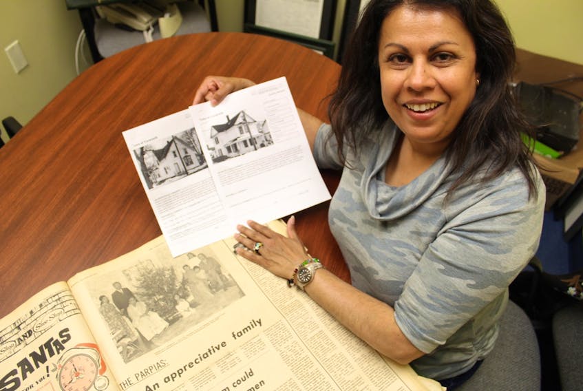 Nimira Parpia (Husein) holds photocopies of houses she discovered could be where their family lived during their stay in Yarmouth. CARLA ALLEN PHOTO