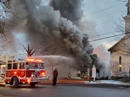 Firefighters battled a blaze that consumed the hall of the Grace United Church in Digby as they worked to protect the church. NEIL MARC POTHIER PHOTO