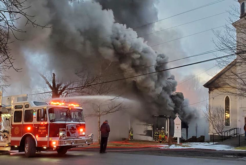 Firefighters battled a blaze that consumed the hall of the Grace United Church in Digby as they worked to protect the church. NEIL MARC POTHIER PHOTO