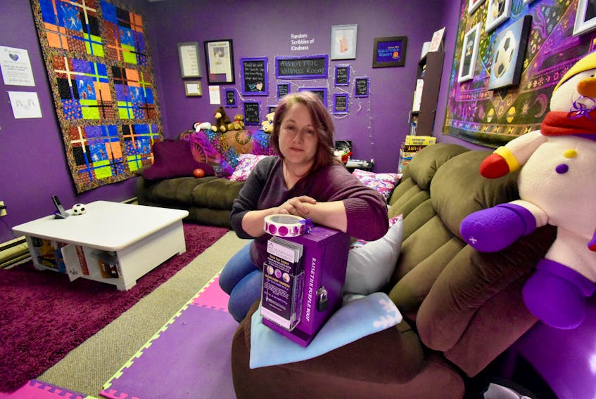 Kelly Mitchell sits in the Aidaen Mae Wellness Room located at the Tri-County Mental Health and Wellness drop-in centre at 101 Water St. The room is purple in memory of her daughter. She'd love to see a purple house to help youth in the community. TINA COMEAU PHOTO
