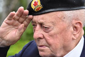 Korean War veteran Kenneth Jeffery salutes after a wreath is laid outside the Wedgeport Legion in Yarmouth County. Because of COVID-19 the veterans wore masks during the ceremony but removed them for this part of the ceremony. TINA COMEAU PHOTO