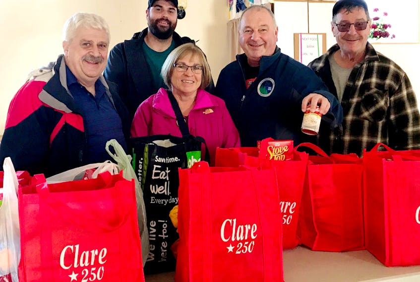 CONTRIBUTED
Municipality of Clare council members drop off community food donations to the Clare Food Bank during the 2018 holiday season. From left: councillors Eric Pothier and Yvon LeBlanc, Marion Comeau of the Clare Food Bank, Clare Deputy Warden Nil Doucet and Coun. Hector Thibault.