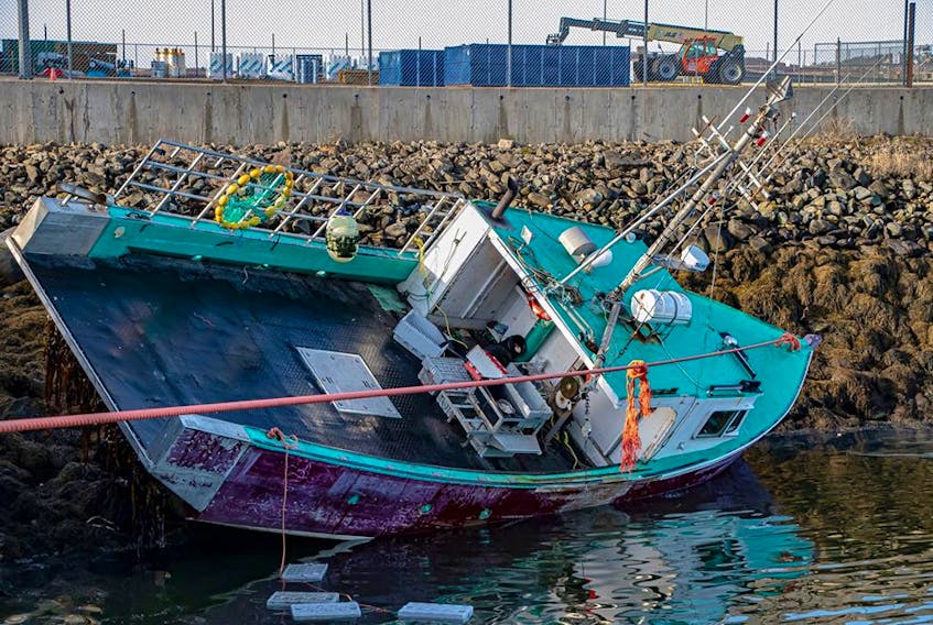 The Sou'Western Shore fishing vessel aground at the Lobster Rock Wharf in Yarmouth. ERVIN OLSEN PHOTO