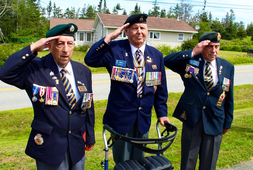 From left: Nelson Deveau, Bob Garron and Leslie Muise salute in front of the war memorial outside the Wedgeport legion hall on Saturday, July 27, after laying a wreath at the monument. The three men – all veterans of the Korean War and members of the Wedgeport legion (branch 155) – were honoured during an event hosted by the Wedgeport branch.