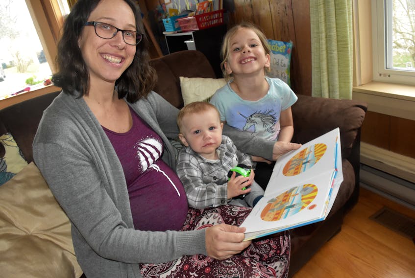 Brianne Gowman, at 30 weeks pregnant, enjoys reading a book to her children Alexander and Annika. But she is also is concerned about a shortage of anesthesiologists that may mean beyond May some women may not be able to give birth at the Yarmouth Regional Hospital.