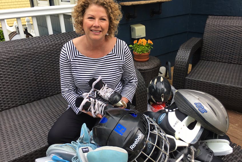 Kelly Goudey with some of the skates and helmets that have been donated so far for youth in the far-north hamlet of Cambridge Bay.