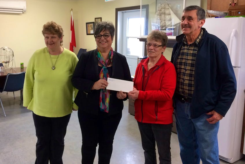 From left: HOPE Centre staff member Shelly Goodwin, Yarmouth Mayor Pam Mood, HOPE co-ordinator Linda Vickery and Doug Thistle, chair of HOPE’s games and activities committee. On Jan. 30 the mayor presented a $500 cheque to HOPE. The money was the monetary prize received by the town for being named a 2018 finalist for a Municipal Innovation Award.