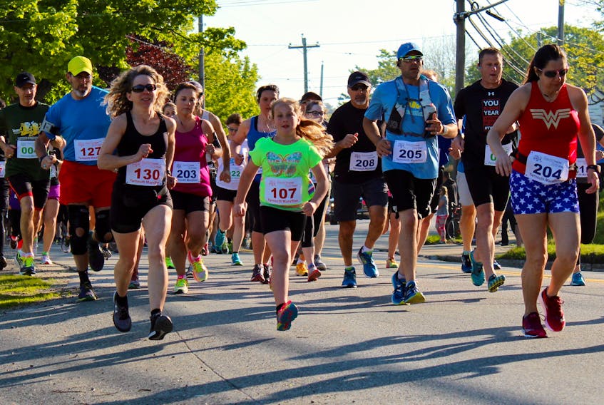 Some of the runners in the 2017 Yarmouth Marathon head south along Main Street at the start of the event.