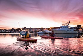 A photo of kayakers on the Yarmouth waterfront made the cover of the 2018 French version of the Doers & Dreamers Travel Guide. ~ Tourism Nova Scotia