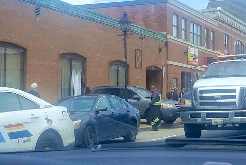 There were no injuries when a vehicle that was being parked on Main Street in Yarmouth on May 6 ended up on the sidewalk and striking a building. PHOTO COURTESY OF REBECCA MAY FUDGE