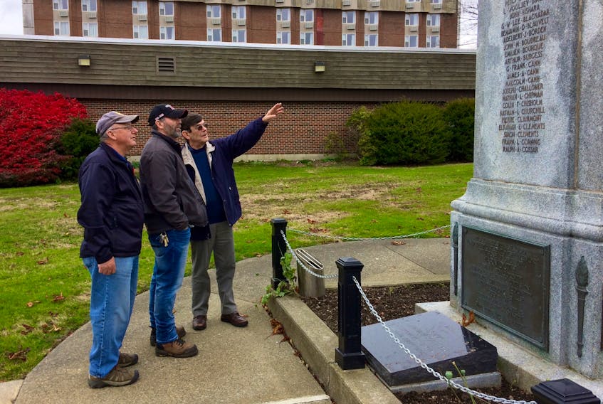 Visiting the Yarmouth cenotaph (from left): Andre Boudreau, secretary of Royal Canadian Legion branch 155 in Wedgeport; Todd Muise, member of the Wedgeport legion; and George Egan, chairman of the Wartime Heritage Association.