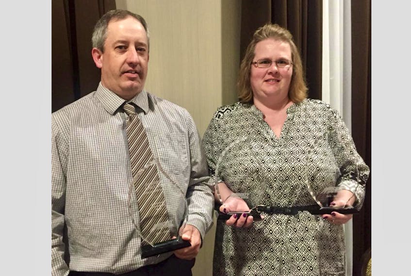 Coach and development coordinator award recipient Andrew Holland and Jennifer Sears, Shelburne County Minor Hockey Association president.
