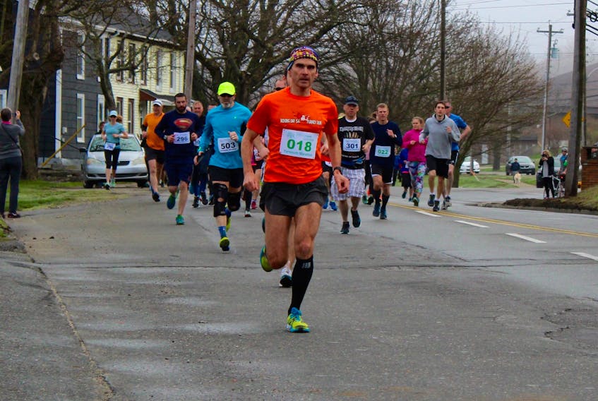 Bryan Hipson leads the way in the early going of the Yarmouth Marathon, which was held Sunday. Hipson would go on to win the 10K portion of the May 5 event.