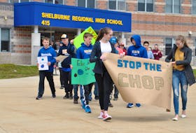Students from Shelburne Regional High School and some community members participating in a May 3 walk aimed at drawing attention to clearcutting and climate change issues. KATHY JOHNSON PHOTO