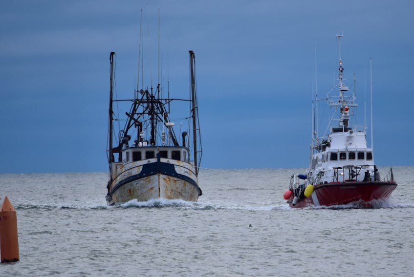 The fish dragger Carmelle No. 3 is towed back to its home port at the Dennis Point wharf in West Pubnico by the Canadian Coast Guard cutter Clark’s Harbour mid-afternoon on Nov. 8, after losing power and becoming disabled the night before. 
KATHY JOHNSON PHOTO