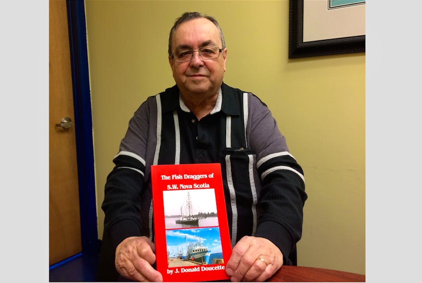 Donald Doucette with his new book. It’s the third book written by the Lower West Pubnico resident.