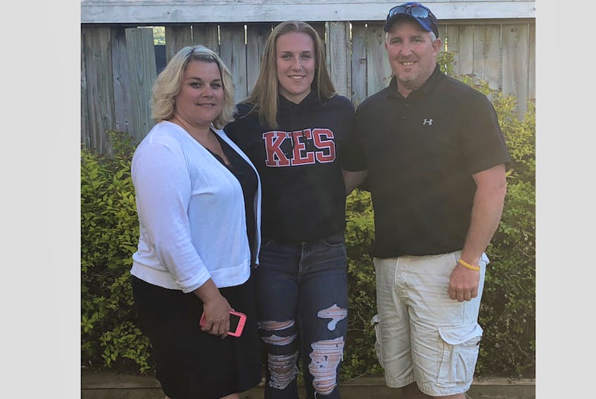 Mackenzie Smith poses with her parents Tara Goulden and Kevin Smith. 
CONTRIBUTED