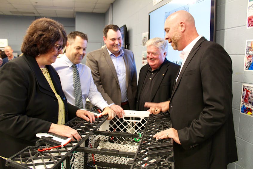 Checking out one of the Ignite Labs displays at NSCC Burridge Campus in Yarmouth on June 29 (from left): Mary Thompson, principal at NSCC Burridge; Doug Jones, founder and executive director of Ignite Labs Inc.; West Nova MP Colin Fraser; Jeffery Mullen, director of enterprise development with ACOA; Scott Dauphinee, managing director of The Lobster Trap Company.