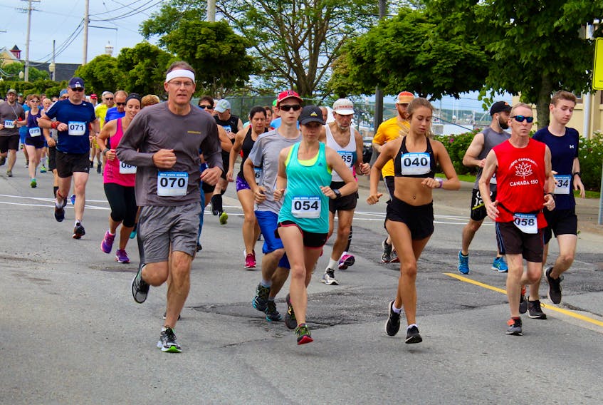 Some of the runners in the 2017 Sheila Poole 10K heading north on Water Street in Yarmouth.