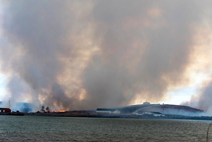 Smoke fills the sky at the scene of a Yarmouth County grassfire on the Hilton Road on March 12.